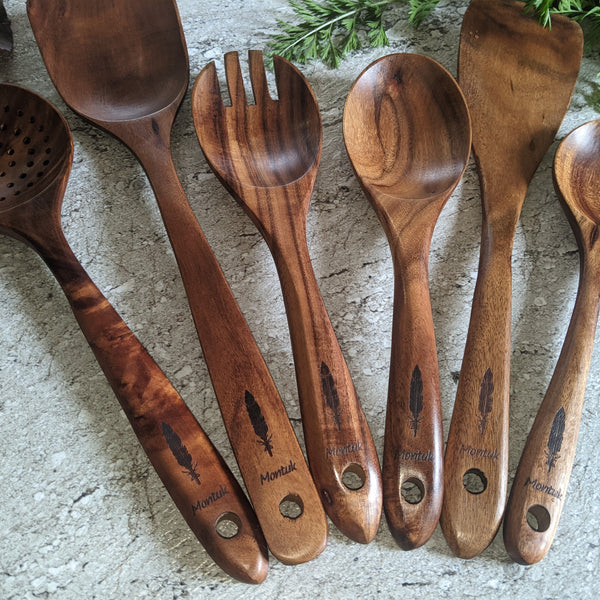 Teak utensil set styled with fresh lemon